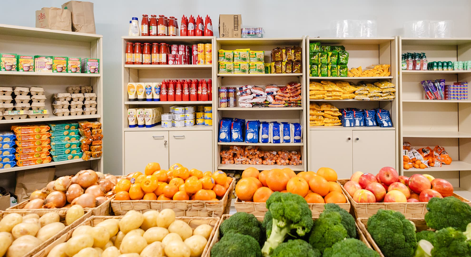 A selection of food and pantry items in including broccoli and mandarins