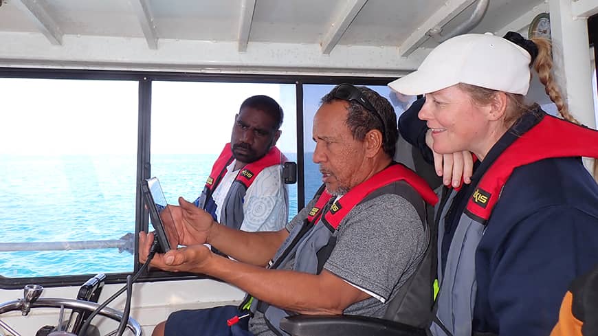Rangers and researchers on boat