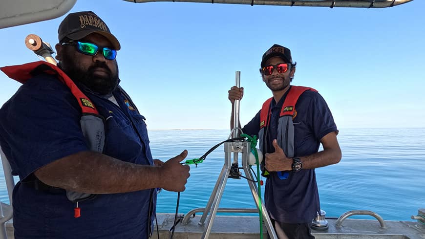 Rangers on boat with equipment