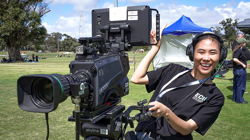 An ECU student operating a camera broadcasting UniSport Nationals.