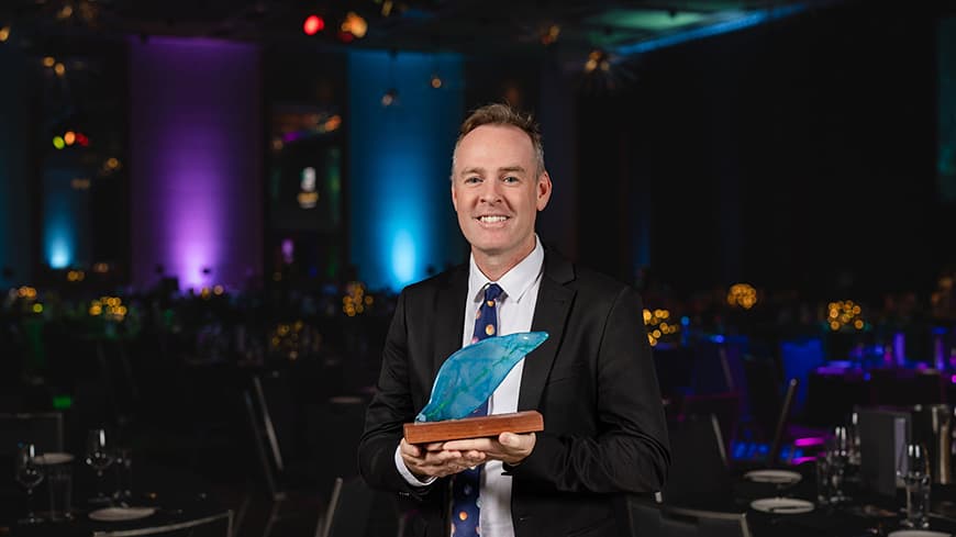 2026 Community and Impact Alumni Award winner Christopher Lambe. Image credit: Kylie Plunkett.