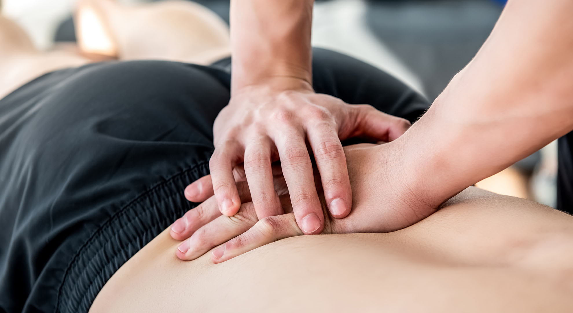 Osteopath working on patient.