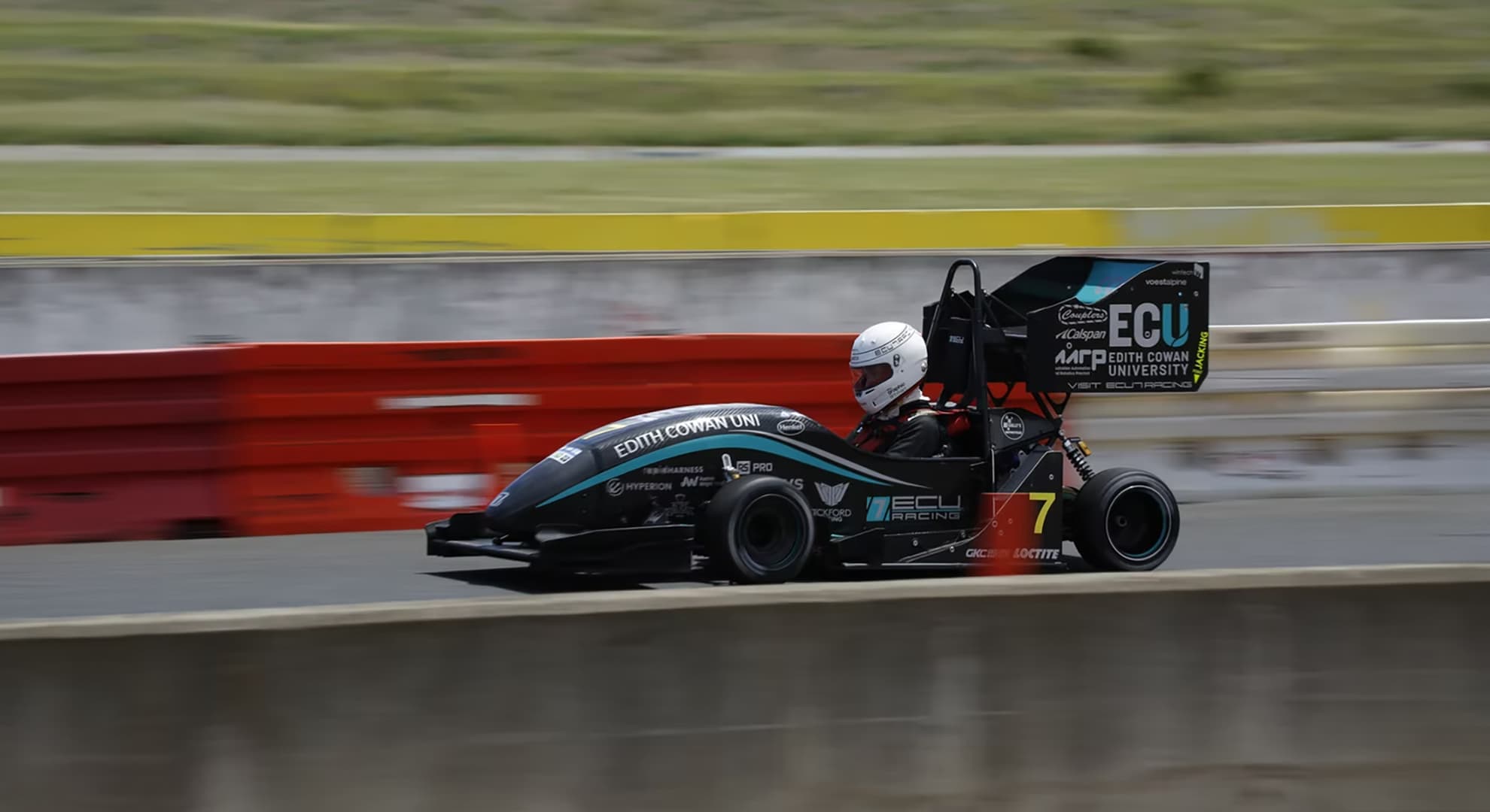 Supercar racing around the track