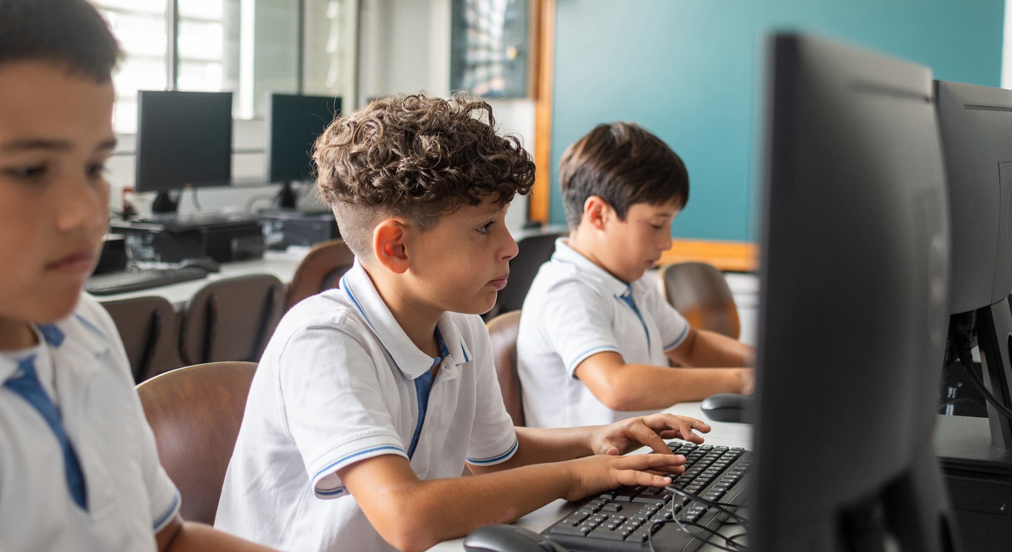 Primary-school aged boys in computer classroom
