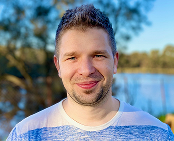 Image of a young man in a blue striped t-shirt