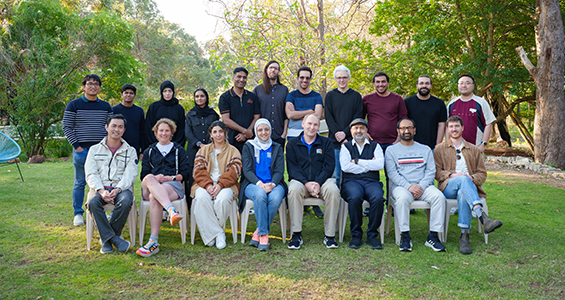 a group of researchers together in a group outside.