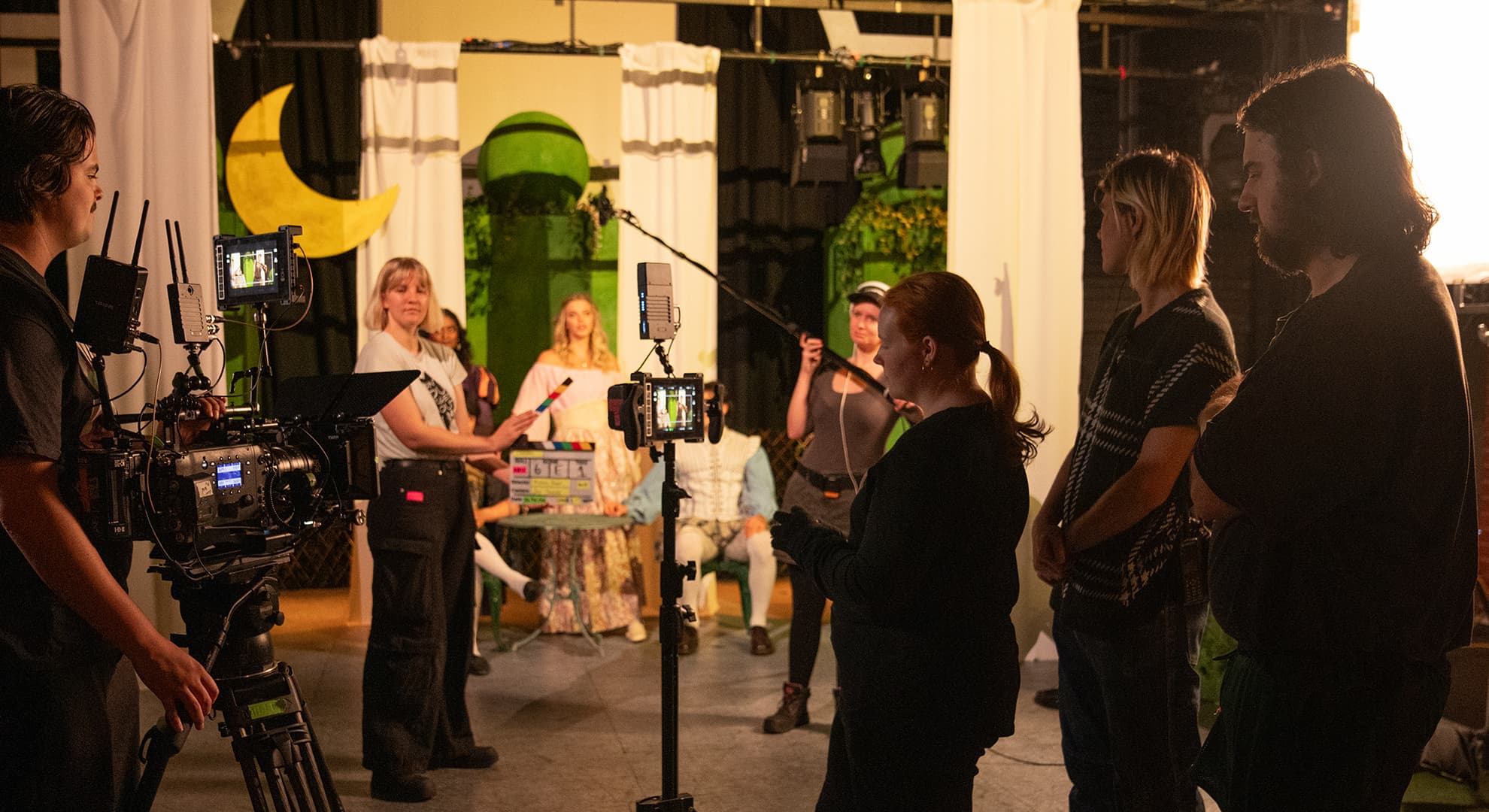 A group of film production students on set.